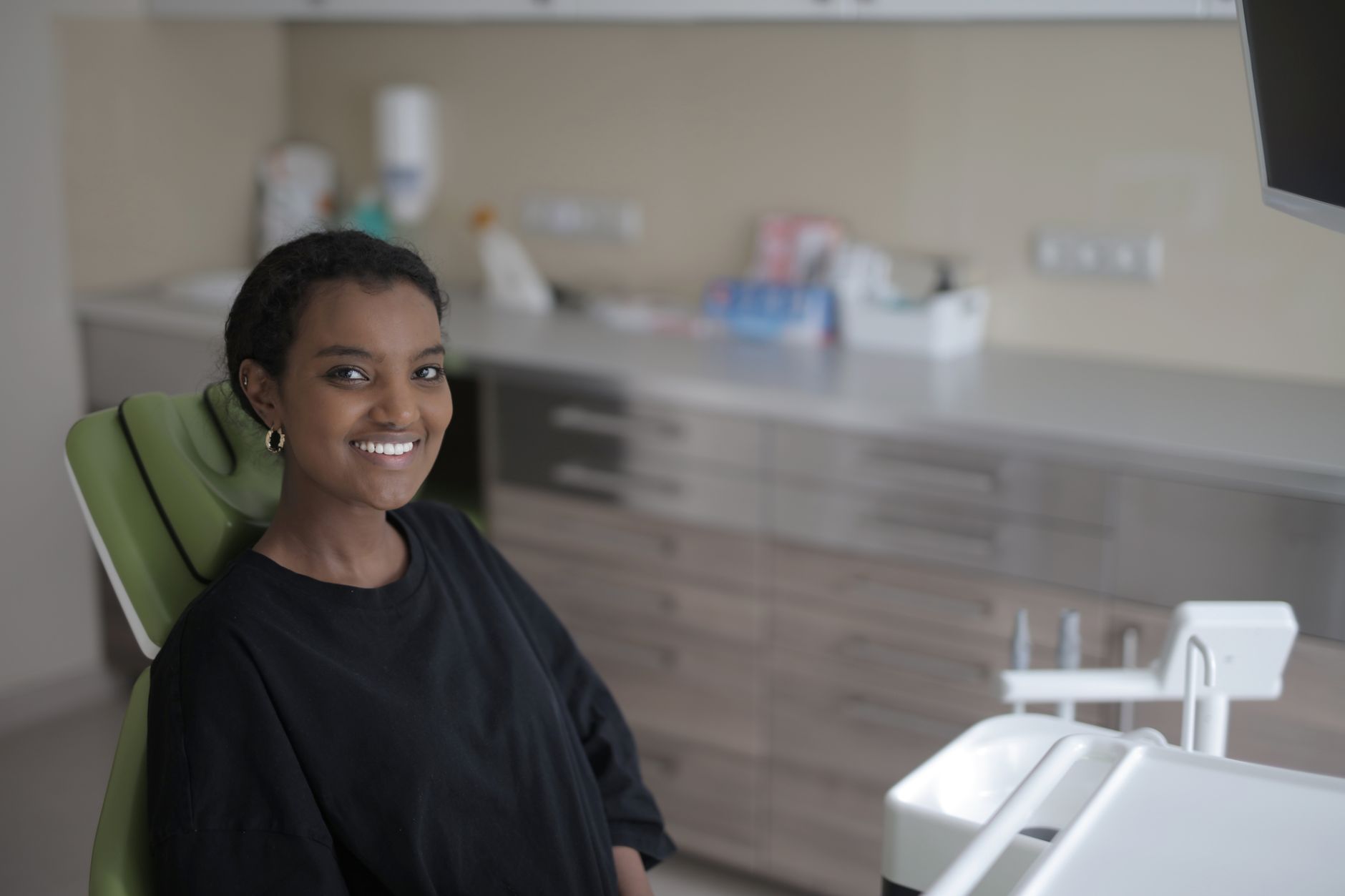 Smiling child with healthy cavity-free teeth after a quick sealant treatment