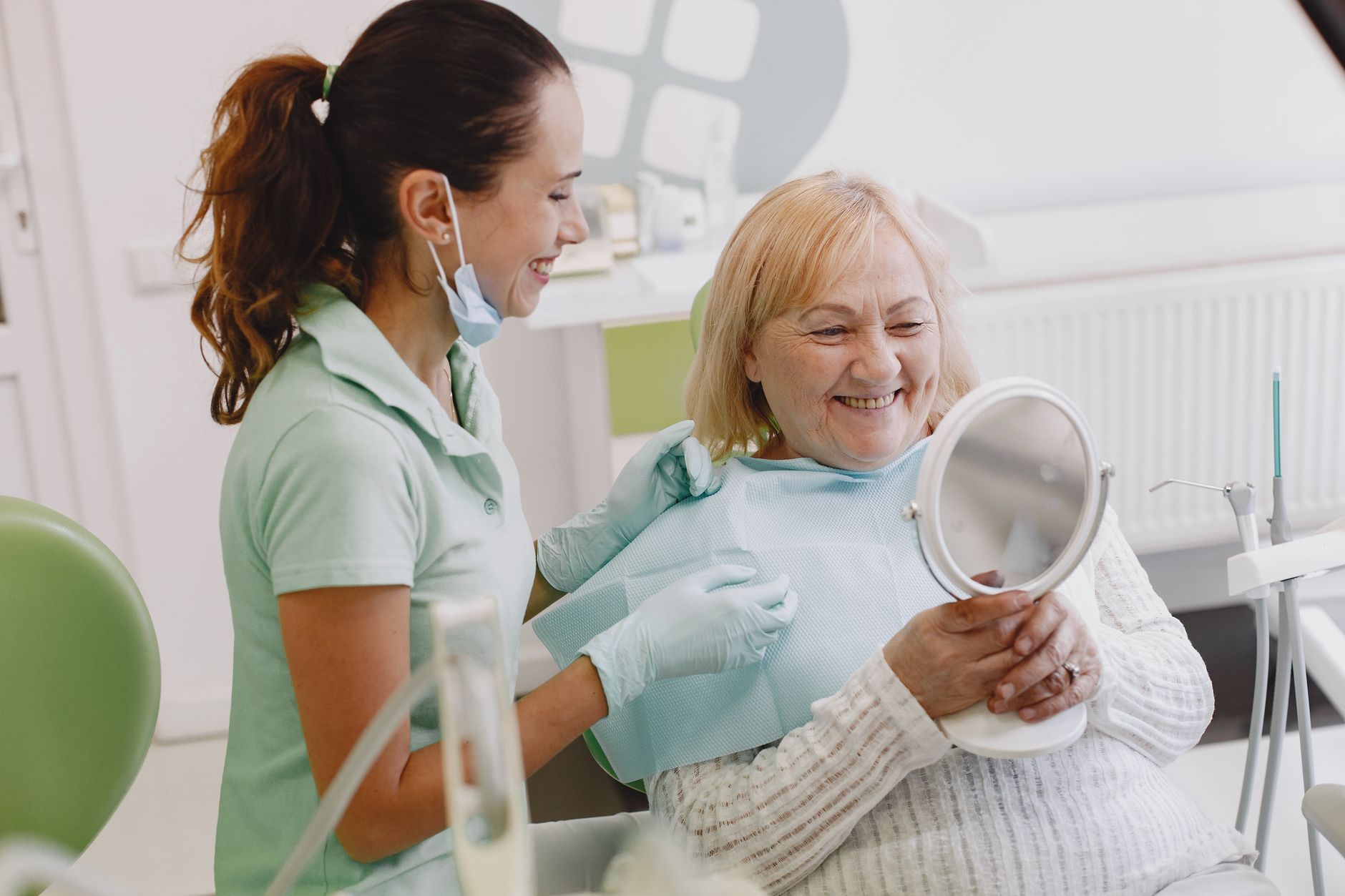 Older patient smiling confidently after implant supported dentures treatment in Sainte-Julie