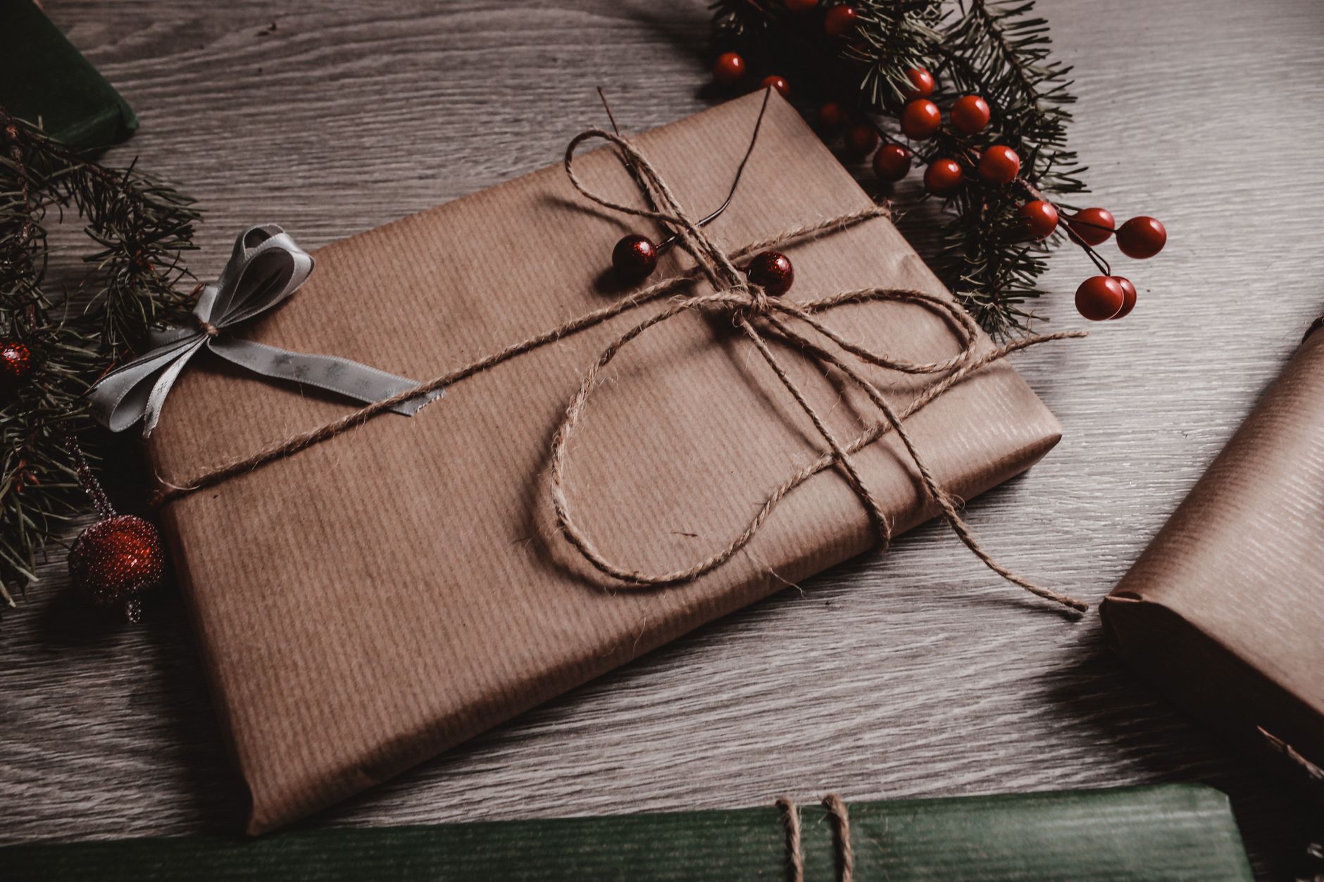 Small present wrapped in kraft paper and twine, showing how simple packaging lifts an affordable gif